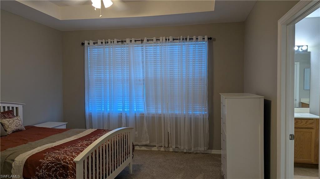 Bedroom with light carpet