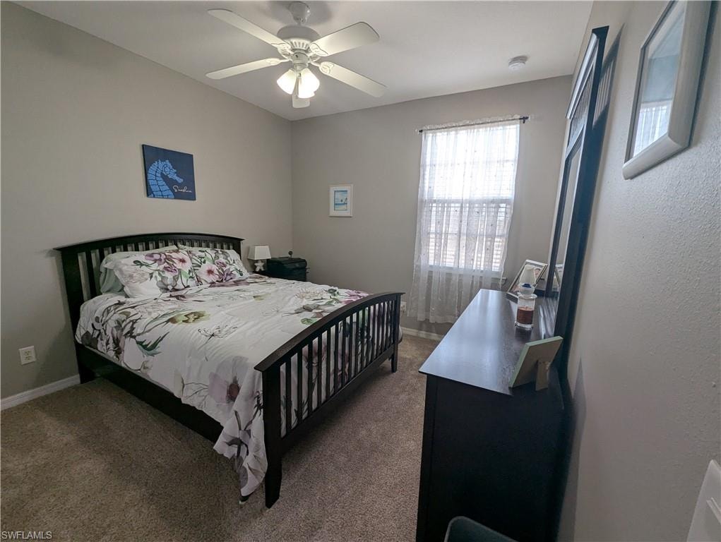 Bedroom featuring carpet flooring and a ceiling fan