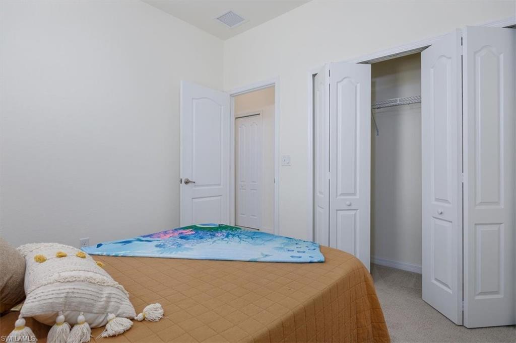 Bedroom with a closet and carpet floors