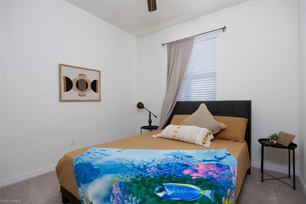 Bedroom featuring carpet and a ceiling fan