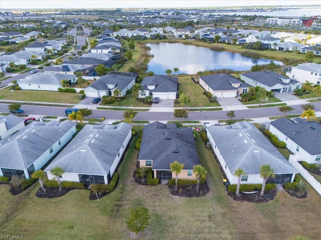 Aerial perspective of suburban area with a large body of water
