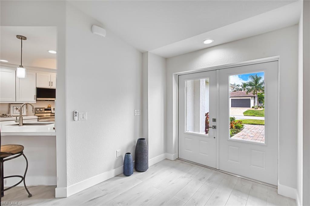Entrance foyer featuring recessed lighting and light wood-style flooring