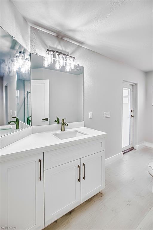 Bathroom featuring vanity and a textured ceiling