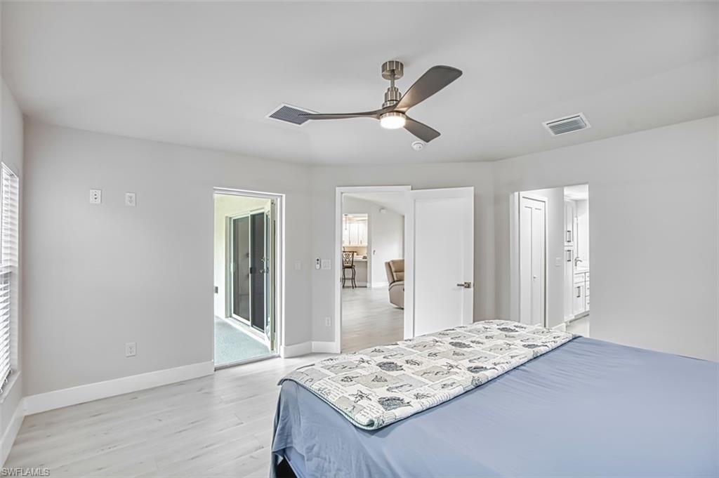 Bedroom featuring light wood-style floors and a ceiling fan