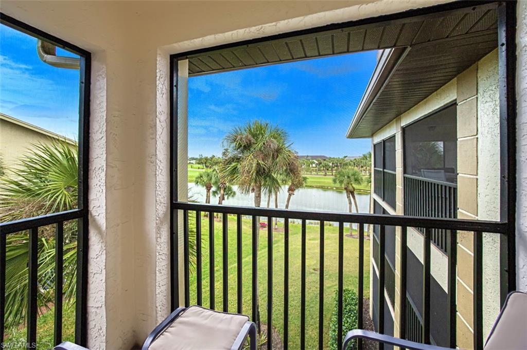 Balcony with a water view and a sunroom