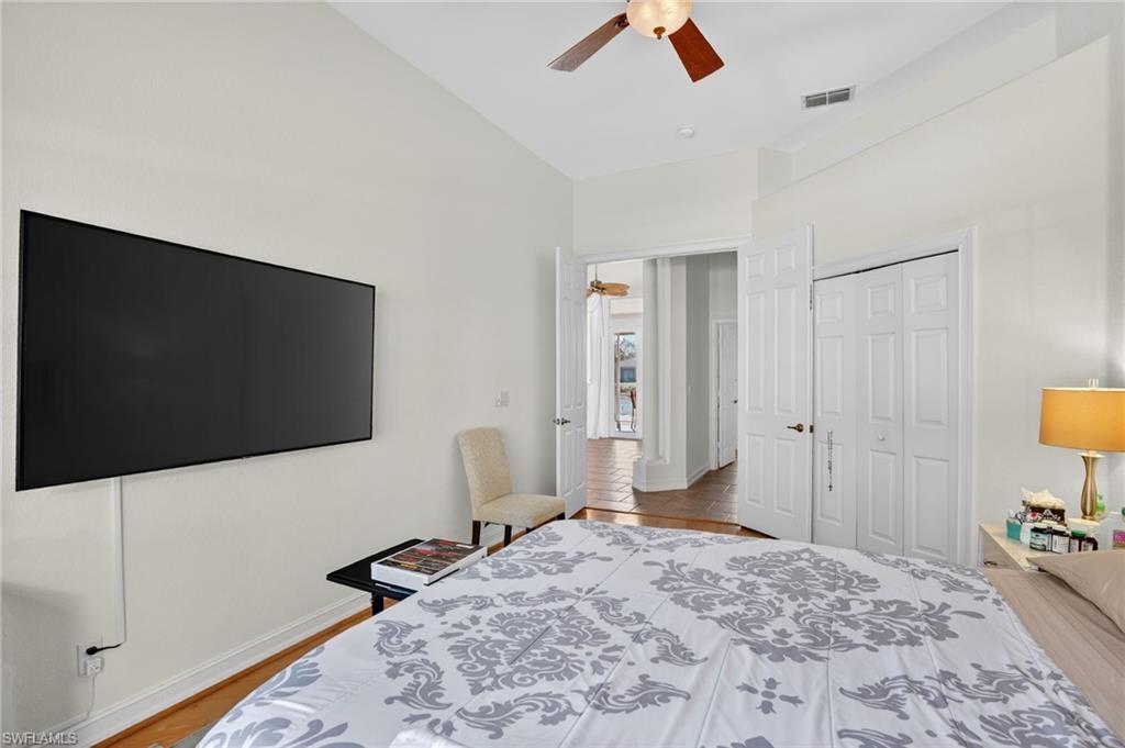 Bedroom featuring a ceiling fan, a closet, and light wood-type flooring