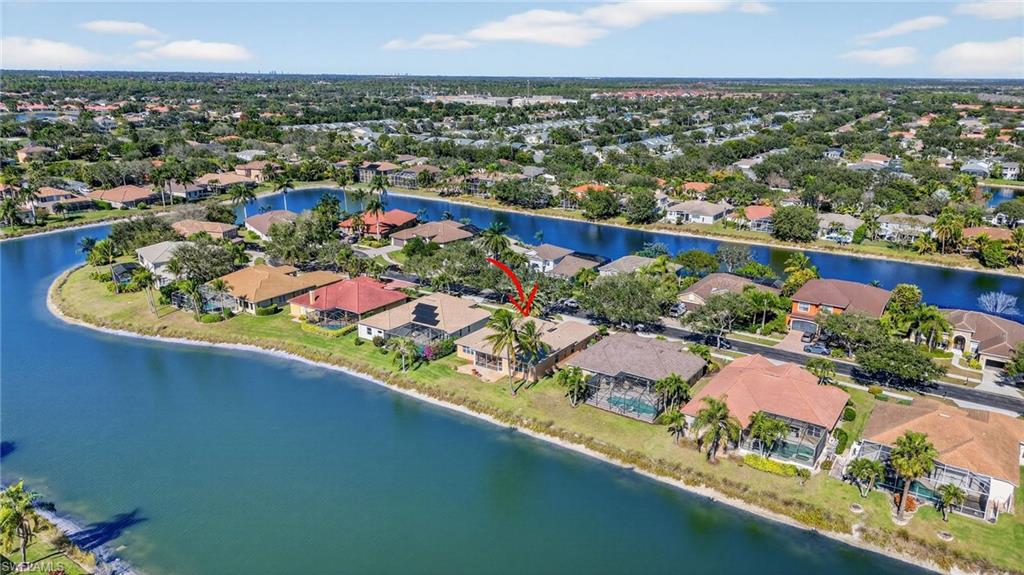 Aerial view of residential area with a nearby body of water