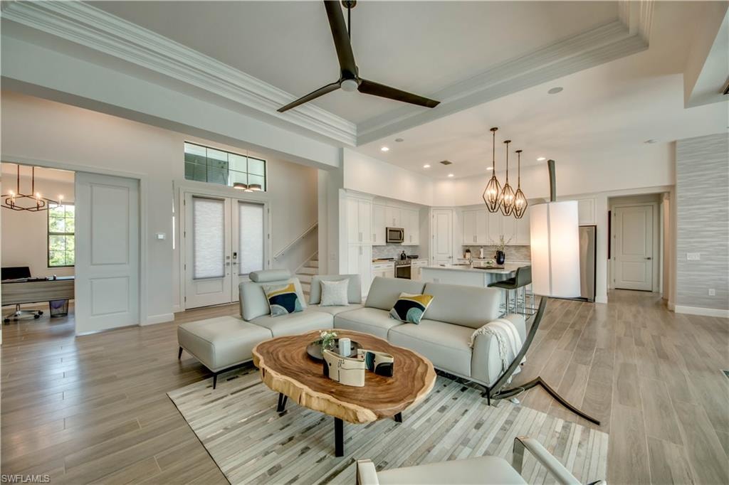 Dining area with wood tiled floors and a chandelier