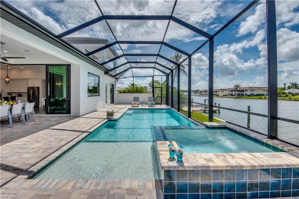 Dock featuring a water view and a yard