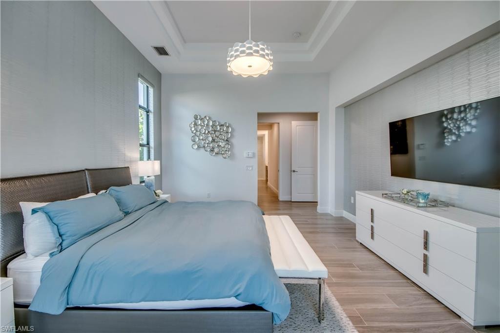 Walk in closet featuring wood finish floors