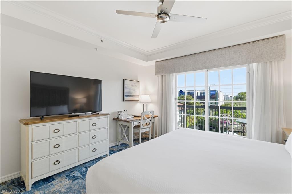 Bedroom featuring access to outside, ornamental molding, ceiling fan, and a desk