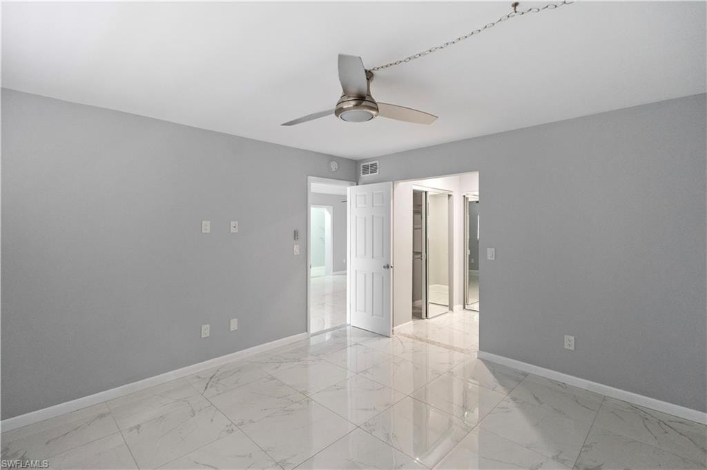Empty room with baseboards and light marble finish flooring