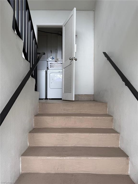 Stairs featuring washer / dryer