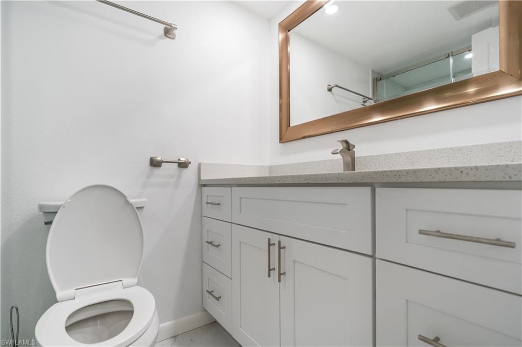 Bathroom with vanity and a shower