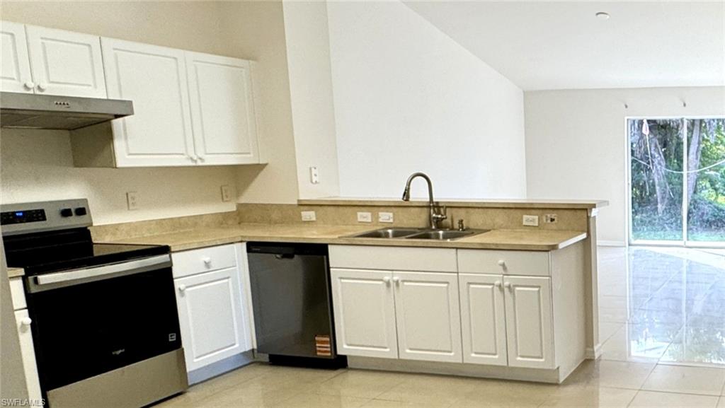 Bright open living space with tile floors throughout.