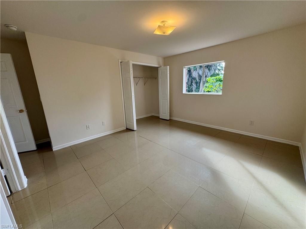 Primary bedroom overlooking backyard