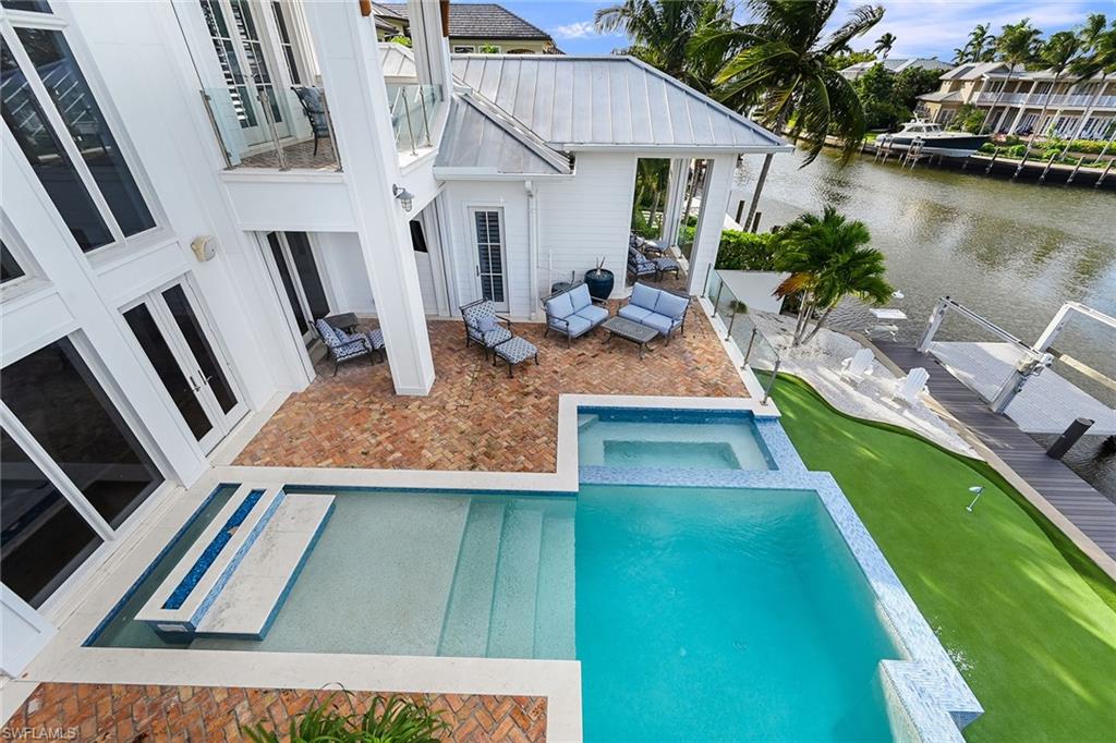 View of heated pool, spa and putting green below