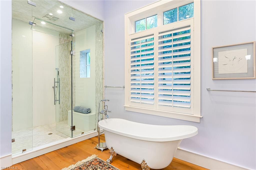 Primary Bathroom with Walk-in Shower and Claw Foot Tub