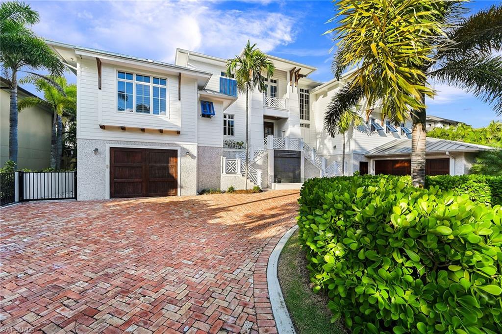 Exterior with circular drive and access to 12 car garage