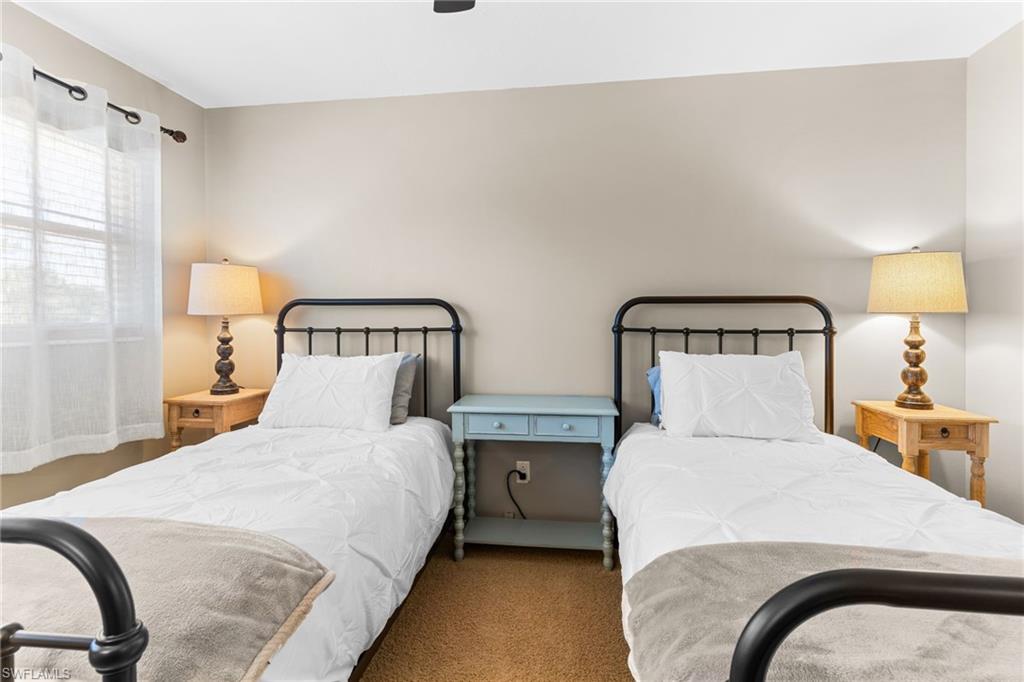 Bedroom with carpet floors and a ceiling fan