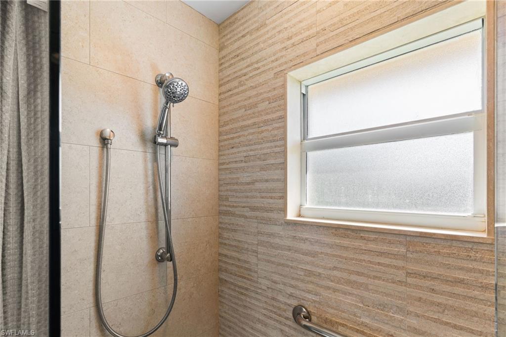 Bathroom view of a tile shower