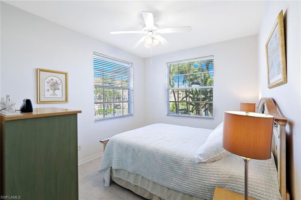 Bedroom with baseboards and ceiling fan