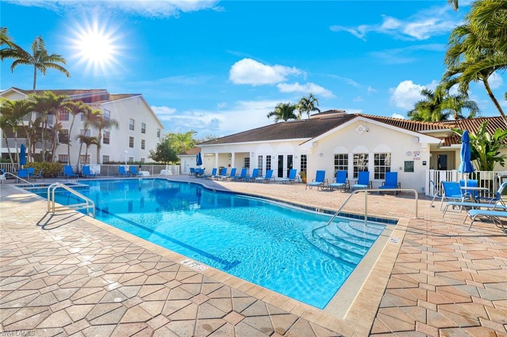 Community pool with a patio area