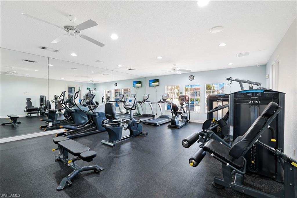 Gym with recessed lighting and ceiling fan