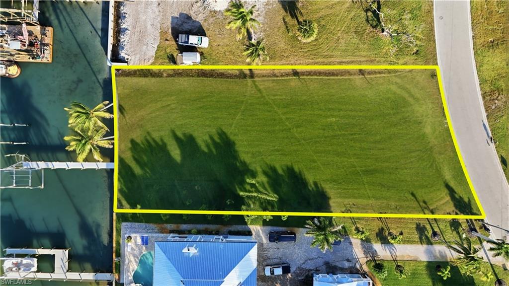 View of property location featuring property parcel outlinedchange color of water into natural dark blue canal water