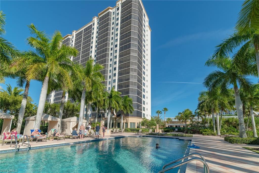 Community pool with a patio