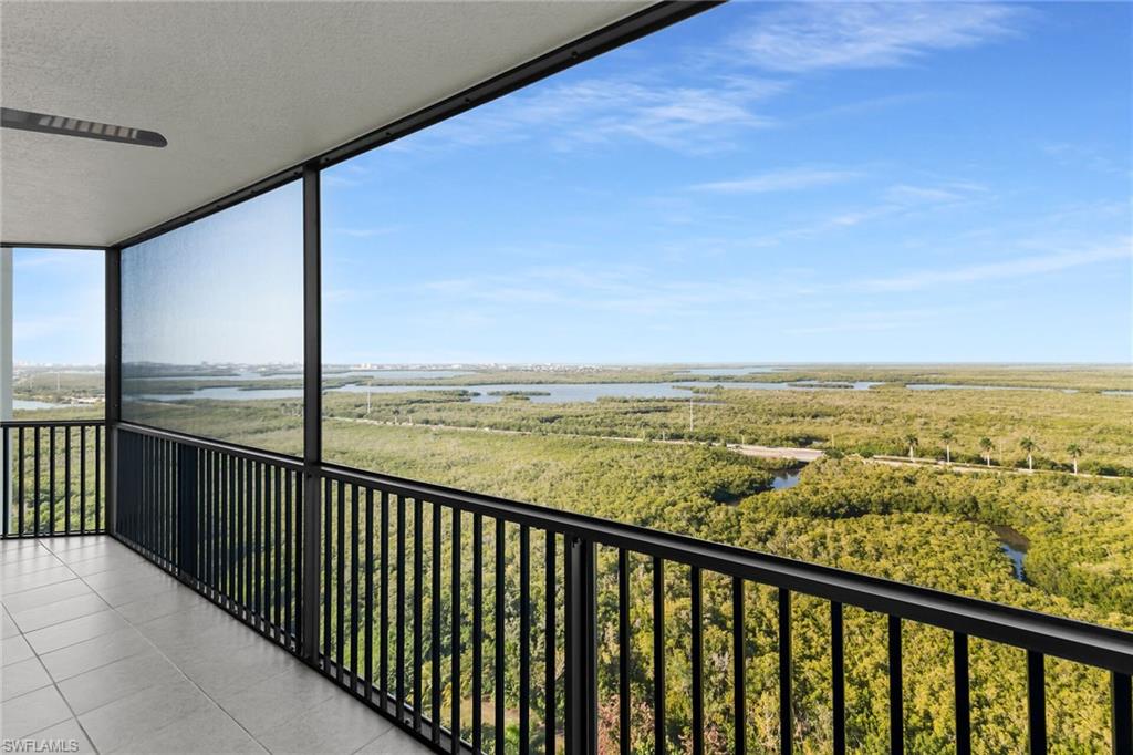 Balcony with a water view and a sunroom