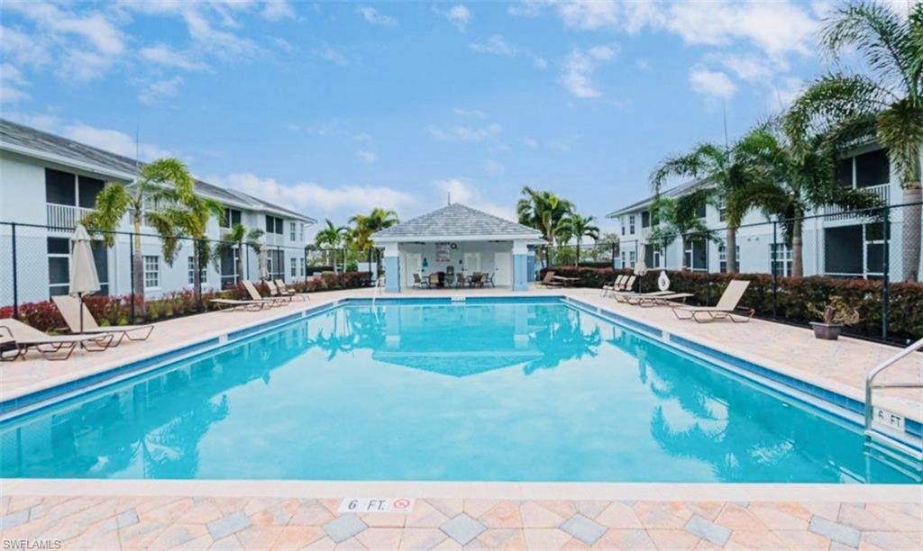 Community pool featuring a patio area and a gazebo
