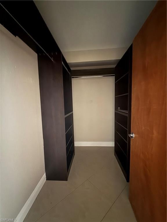 Walk in closet featuring light tile patterned floors