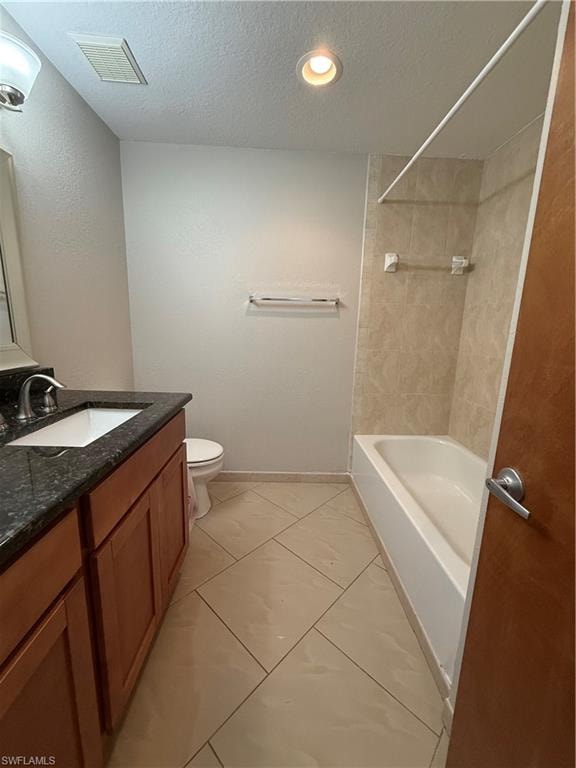 Full bath with a textured ceiling, vanity, washtub / shower combination, light tile patterned floors, and recessed lighting