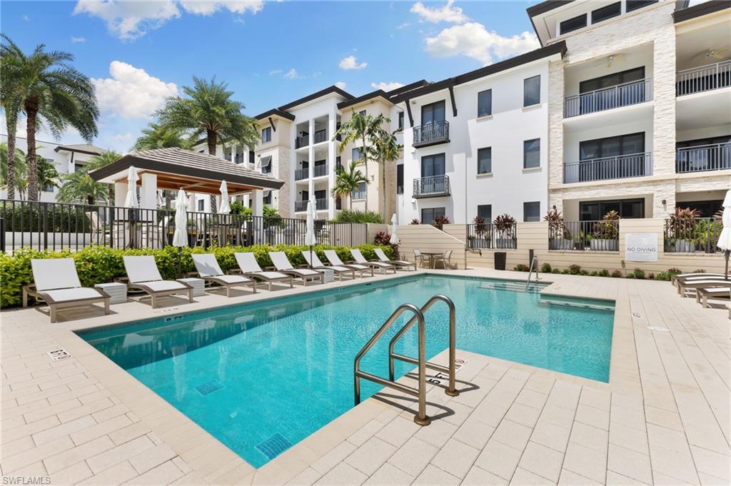 Community pool featuring a patio