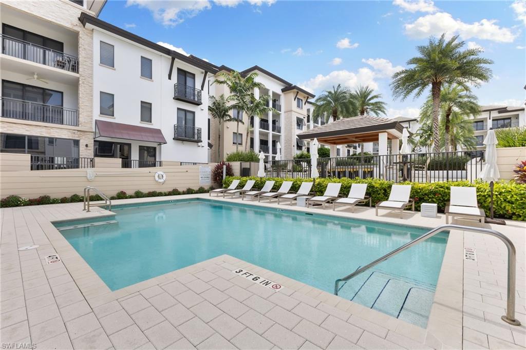 Community pool with a patio area
