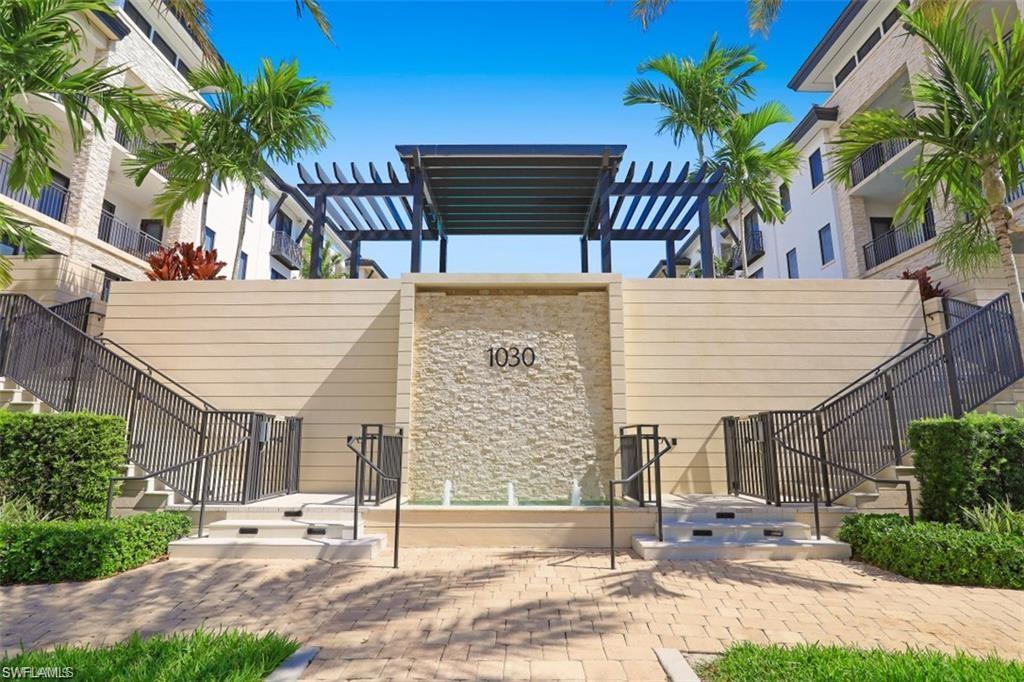View of property's community featuring stairway and a pergola