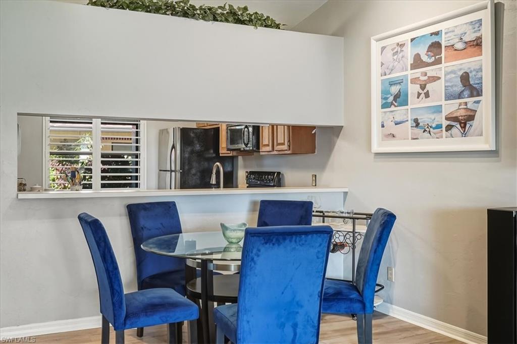 Dining space featuring light wood finished floors and baseboards