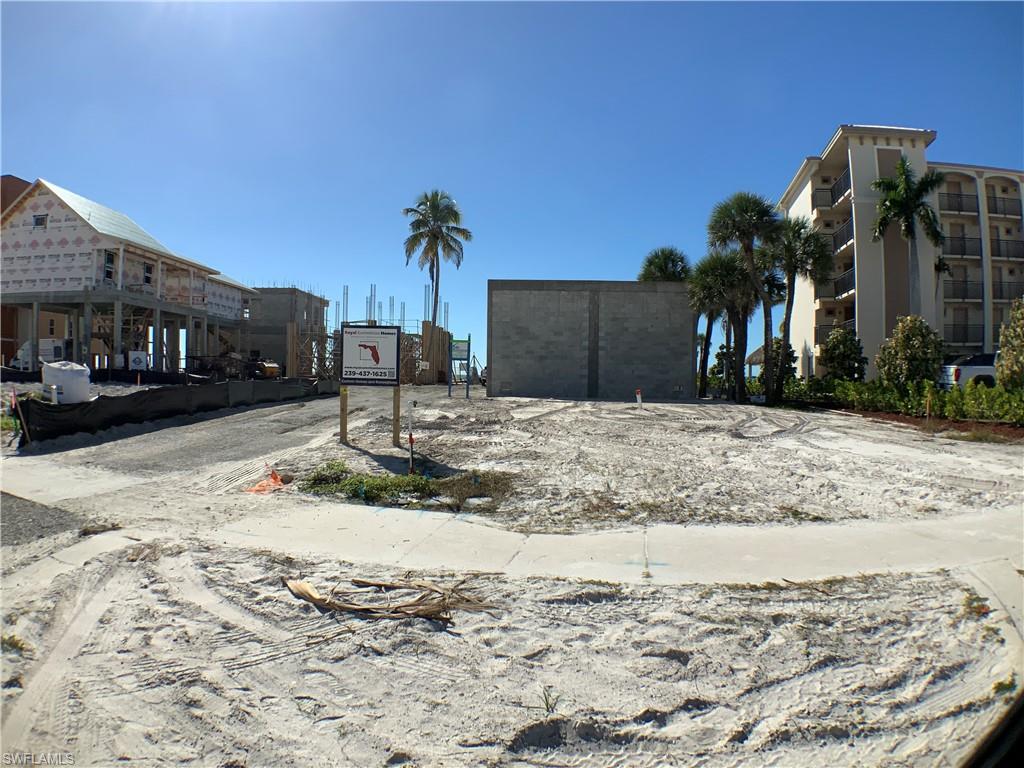 Looking in to lot front Estero Blvd house being built on lot behind  it can be seen, small sandy road on left side of lot gives access to other lots