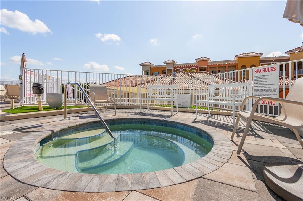 View of pool featuring a swimming pool and a hot tub