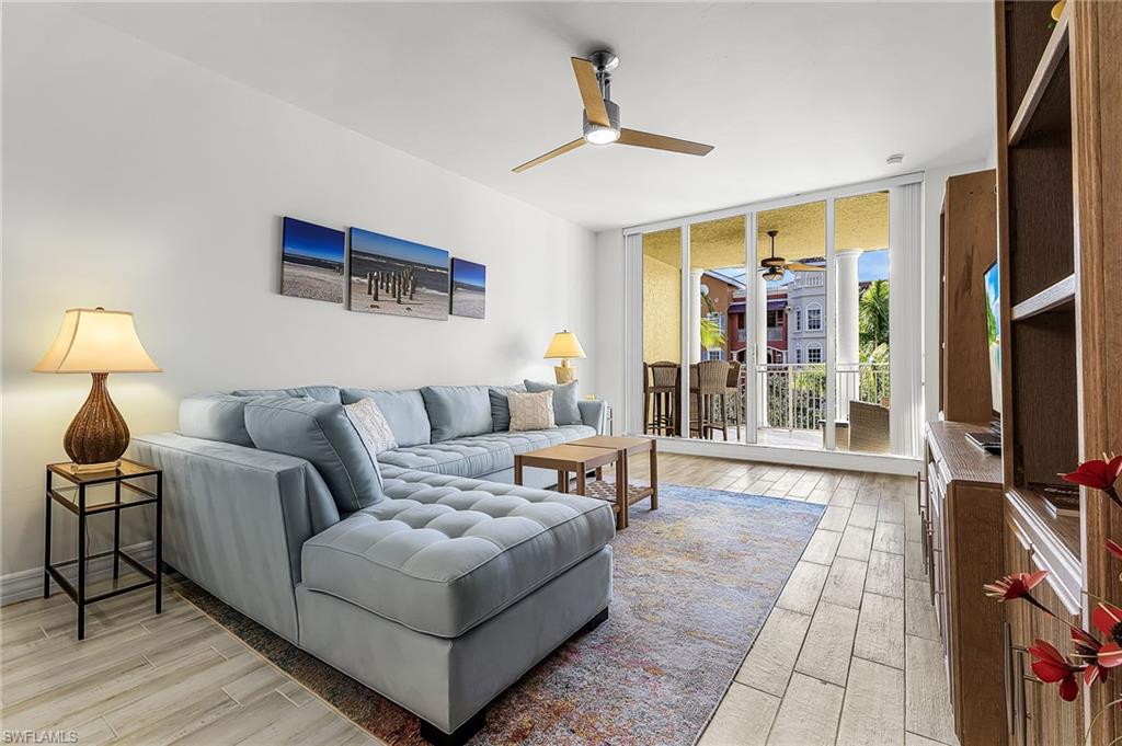 Living room with high ceilings and sliders to lanai