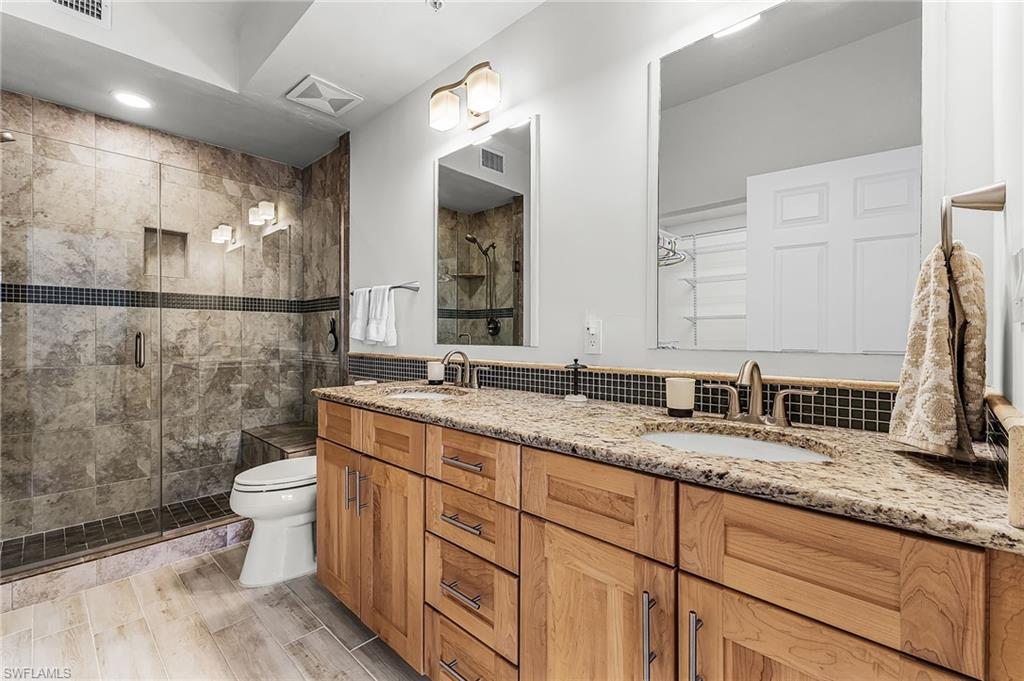 Primary Bathroom with double vanity and double shower stall