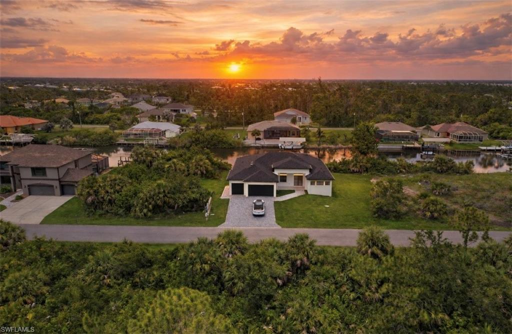 Aerial view at dusk of a residential view (Rendered photo)