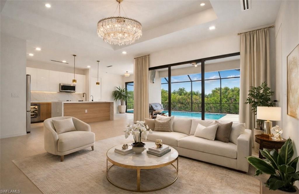 Living area with suspended lighting and a raised ceiling (Rendered photo)