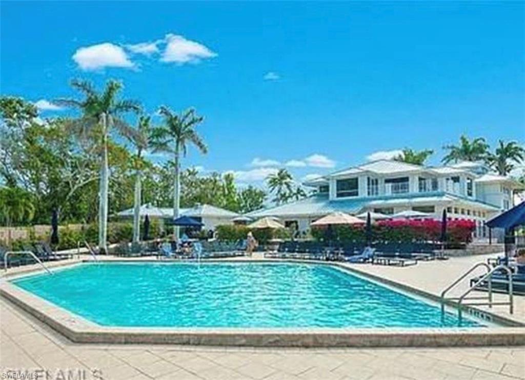 Community pool featuring a patio