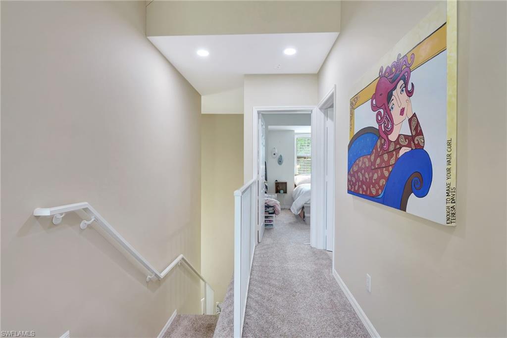 Corridor featuring baseboards, recessed lighting, an upstairs landing, and carpet