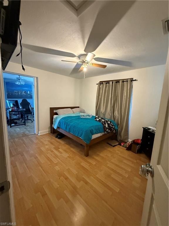Bedroom featuring light wood-style flooring and ceiling fan