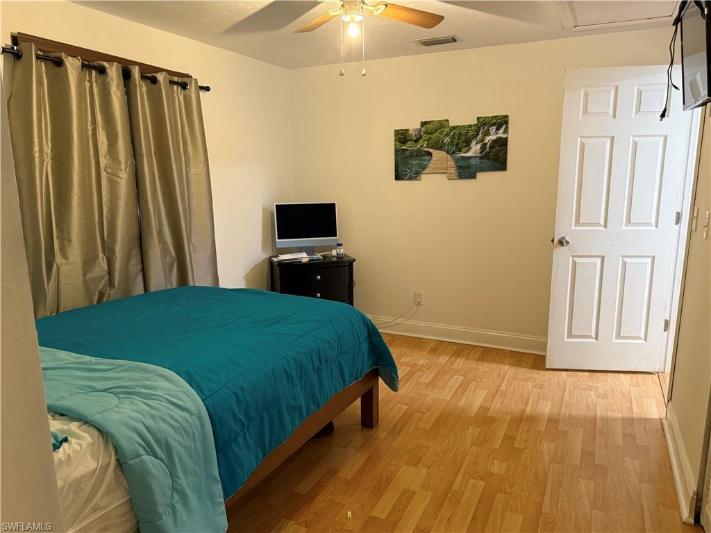 Bedroom with wood finished floors and ceiling fan