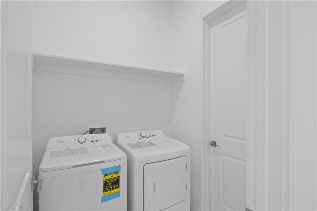Washroom with washing machine and dryer