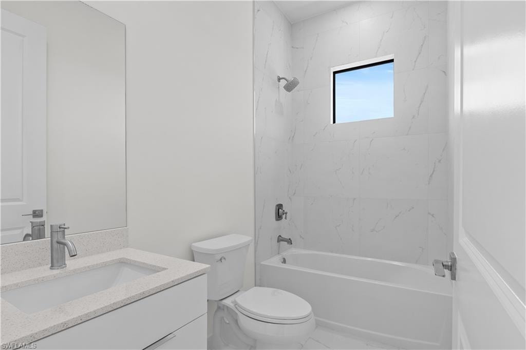 Full bathroom with bathing tub / shower combination and vanity